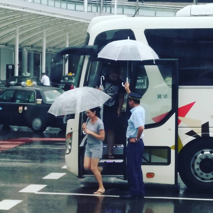 japan bus driver hold umbrella - Nba