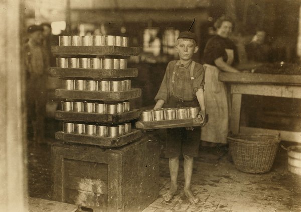 “One Of The Small Boys In J. S. Farrand Packing Co. And A Heavy Load.

Location: Baltimore, Maryland”