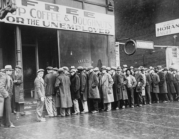Unemployed men queued outside a depression soup kitchen opened in Chicago, 1931.