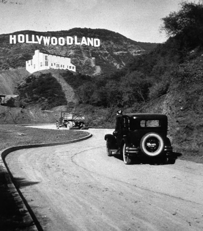 The iconic Hollywood sign in Los Angeles was originally an ad for the hill's biggest real estate company, Hollywoodland. 

The sign lost the "LAND" in 1949, when the Hollywood Chamber of Commerce began a contract with the City of Los Angeles Parks Department to repair and rebuild the sign. The contract stipulated that "LAND" be removed to spell "Hollywood" and reflect the district, not the "Hollywoodland" housing development.