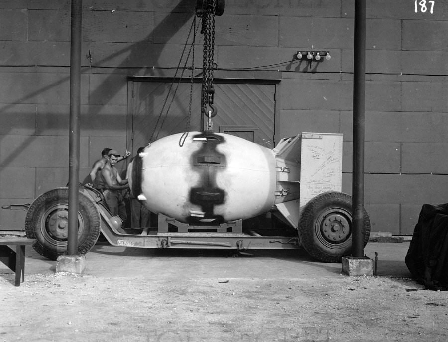 The “Fat Man” atomic bomb is loaded onto a transport trailer and given a final once-over before being transported and loaded up onto the aircraft, that would eventually be dropped over Nagasaki, marking the second documented usage of nuclear weapons in warfare.