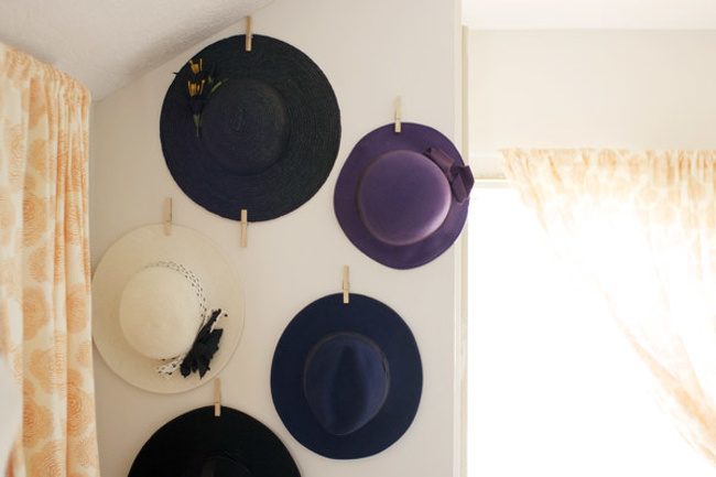 A hanger for hats made of clothespins