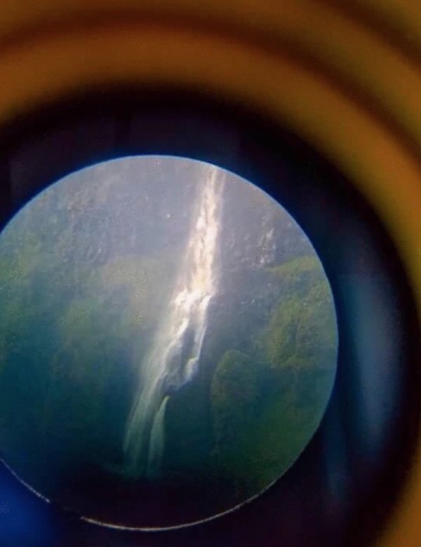Waterfall viewed through a telescope