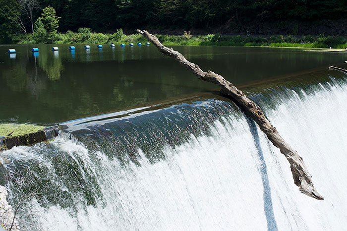 Perfectly balanced log on waterfall