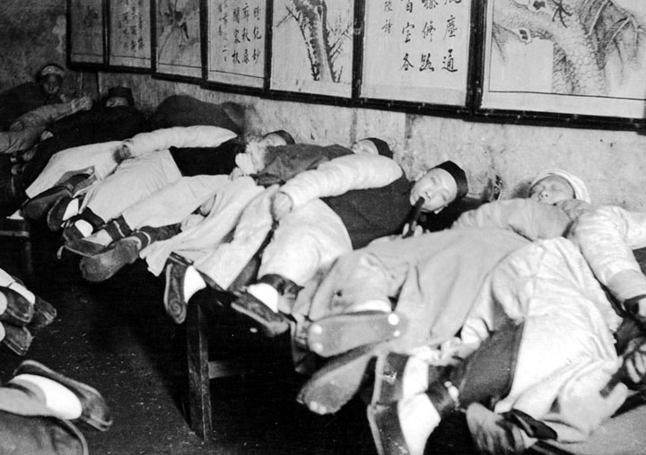 A Chinese opium den, circa 1900.