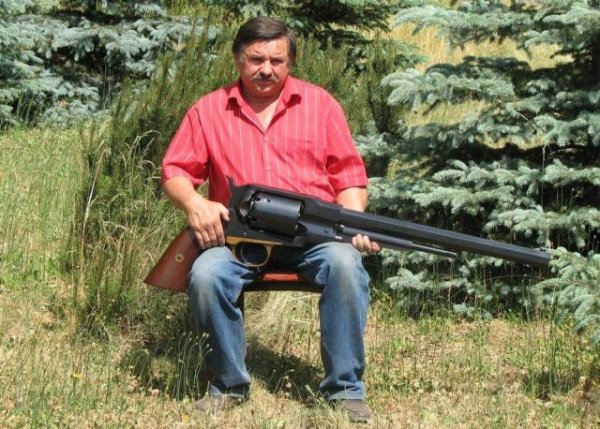 Man holding oversized gun