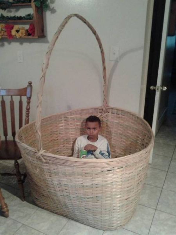 Little boy in big basket