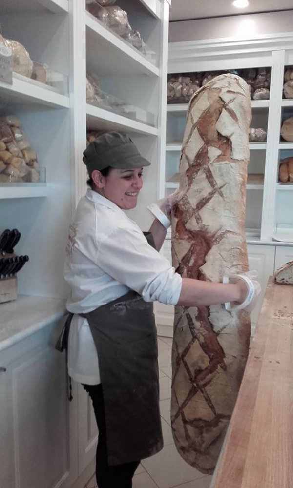 Woman holding huge bread