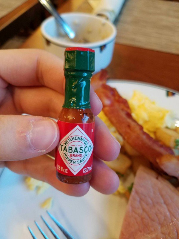 Mini bottles of hot sauce at the hotel.