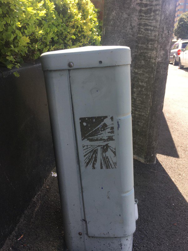 “This residue from a peeled-off sticker on a utility box reminds me of a cover of 70s sci-fi novel.”