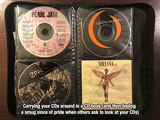 compact disc - Pearl Jam a perfectCarele Nirvana Pac Vo Carrying your CDs around in a Cd book and then feeling a smug since of pride when others ask to look at your CDs