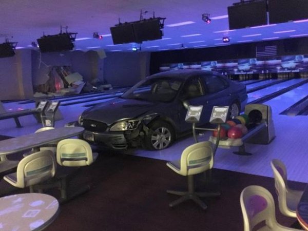 car crashes into bowling alley