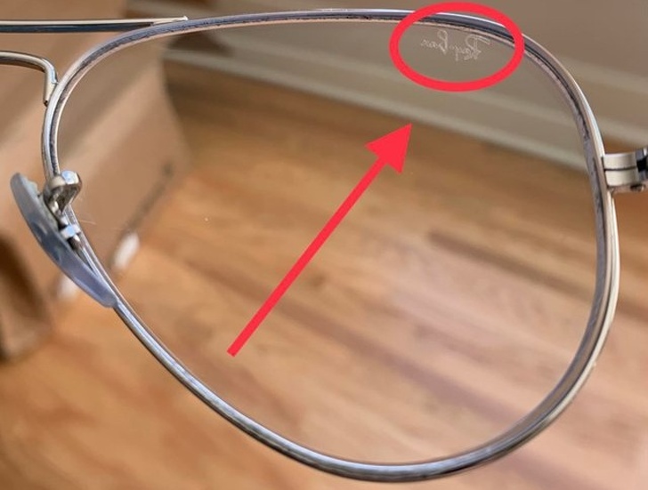 Laser-etched branding on prescription glasses looks like they have a smudge on them to the person wearing them.