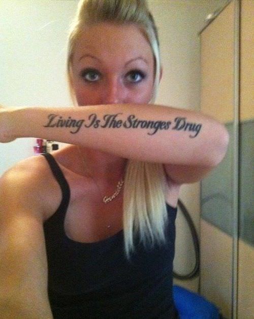 bad tattoos - tattoo fails - Living Is The Stronges Drug