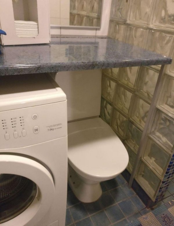toilet that is under a granite countertop