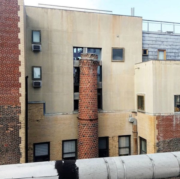 chimney that reaches right up to a window