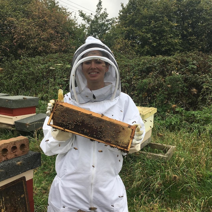 Lena Headey is holding a honeycomb.