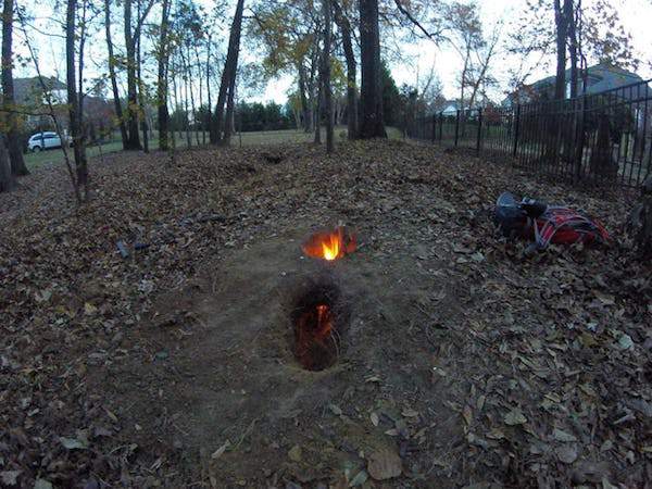 A Dakota Fire Hole can save your life.
If you’re ever in a survival situation and you need a fire, but don’t want to let anyone know where you are, this’ll help. If you dig a tunnel and start a fire in one of the entrances, the other entrance will provide oxygen for the flames. This’ll protect you and the fire from bad guys and the wind.