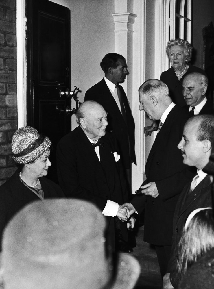 Sir Winston Churchill, left, shakes hands with French President Charles de Gaulle as the latter leaves Sir Winston's London home at Hyde Park Gate, London on April 6, 1960, after a special private visit.