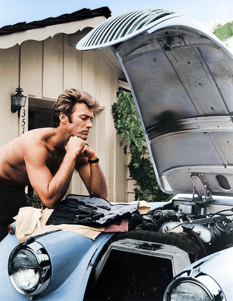 Clint Eastwood working on his 1958 Jag XK 120 in 1960.