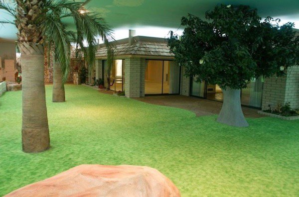 Not only did he build a house inside his bunker, he also built a guest house, surrounded by a lawn, putting green, fake trees, fake rocks, and a fake sky.