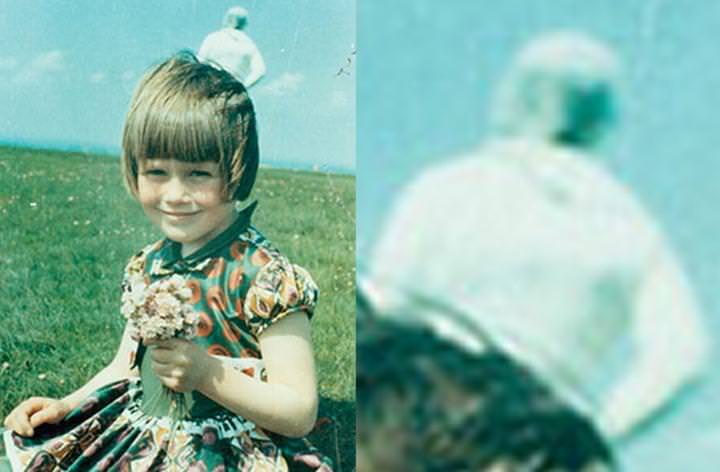 The Solway Spaceman. Tim Templeton thought he had snapped up a picture of an astronaut lurking behind his five year old, Elizabeth. He denies ever seeing any sort of figure while taking the photo at Burgh Marsh, near Solway Firth in Cumbria, and claims it only appeared after the image was developed. But the weirdest part was when the family said they were visited by two government officials who identified themselves as number 11 and number nine, and were asked to be escorted to the scene of the photograph. To this day, skeptics suggest the figure is Templeton's wife, Annie, where the camera flash made her appear bright white due to overexposure. However, official government investigations were unable to prove or disprove the image.