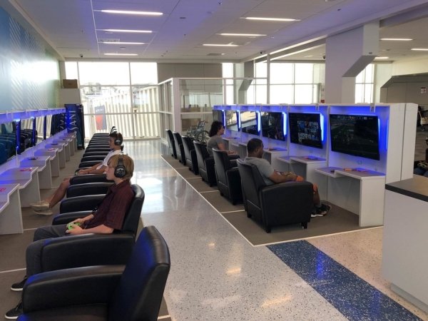 At the Dallas International Airport, you can pass the time waiting for your next flight while chilling at video game lounges.