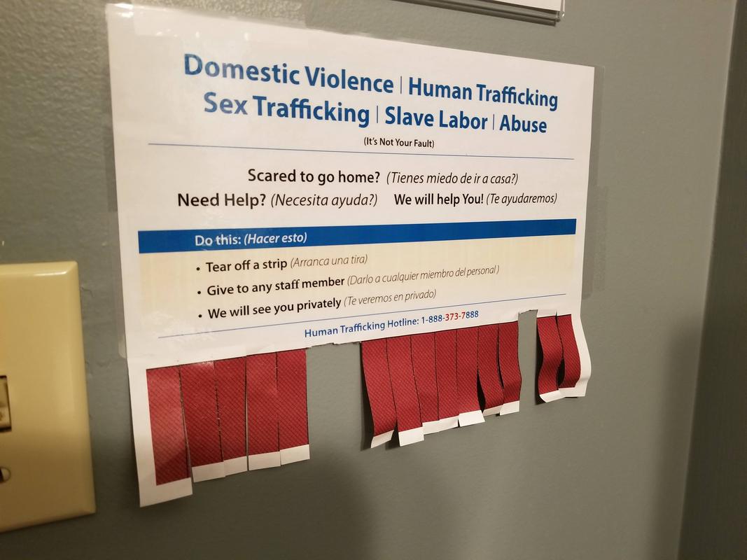 human trafficking bathroom sign