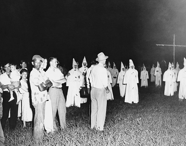 A lone African-American man attends a Klan rally in Jackson, Mississippi (1950)