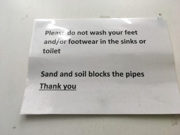 label - Please do not wash your feet andor footwear in the sinks or toilet Sand and soil blocks the pipes Thank you