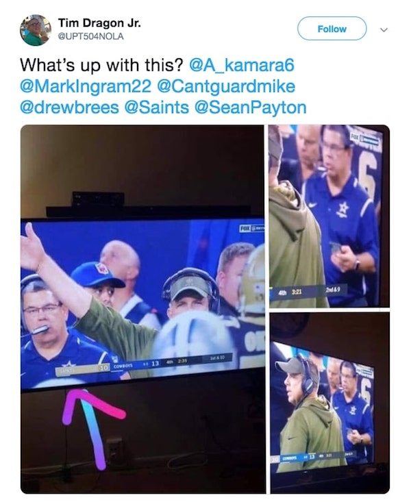 A fan watching last night’s game against the Dallas Cowboys and the New Orleans Saints on television screenshotted a moment in the game where a Dallas Cowboys staffer was holding a cell phone.