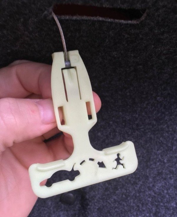 “The manual release on my trunk latch depicts a person presumably trapped, escaping, and sprinting away to freedom. It also glows in the dark so folks trapped in the trunk can see it.”