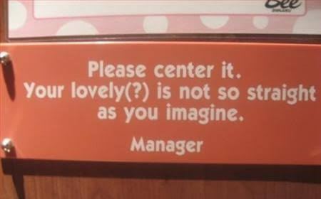signage - Please center it. Your lovely? is not so straight as you imagine. Manager