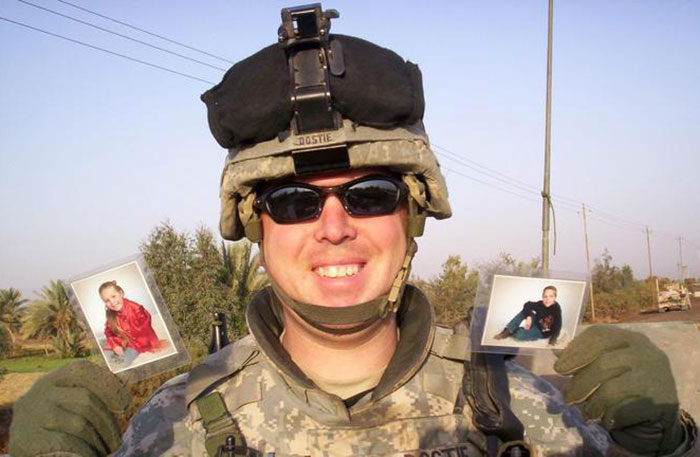 My Father, SFC Shawn Dostie, Holding Up Pictures Of My Sister And I That We Sent Him For Christmas. He Died Just Six Days After This Photo Was Taken