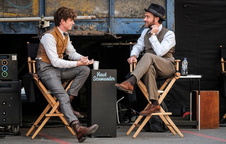 Eddie Redmayne and Jude Law chatting on the set of The Crimes of Grindelwald