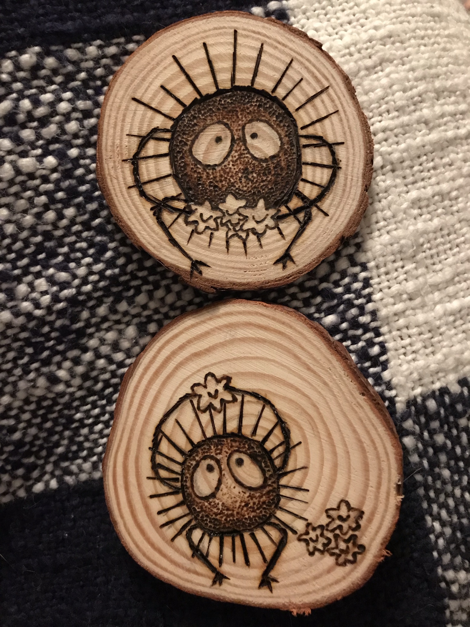 work meme of the soot sprites from Spirited Away carved into wood