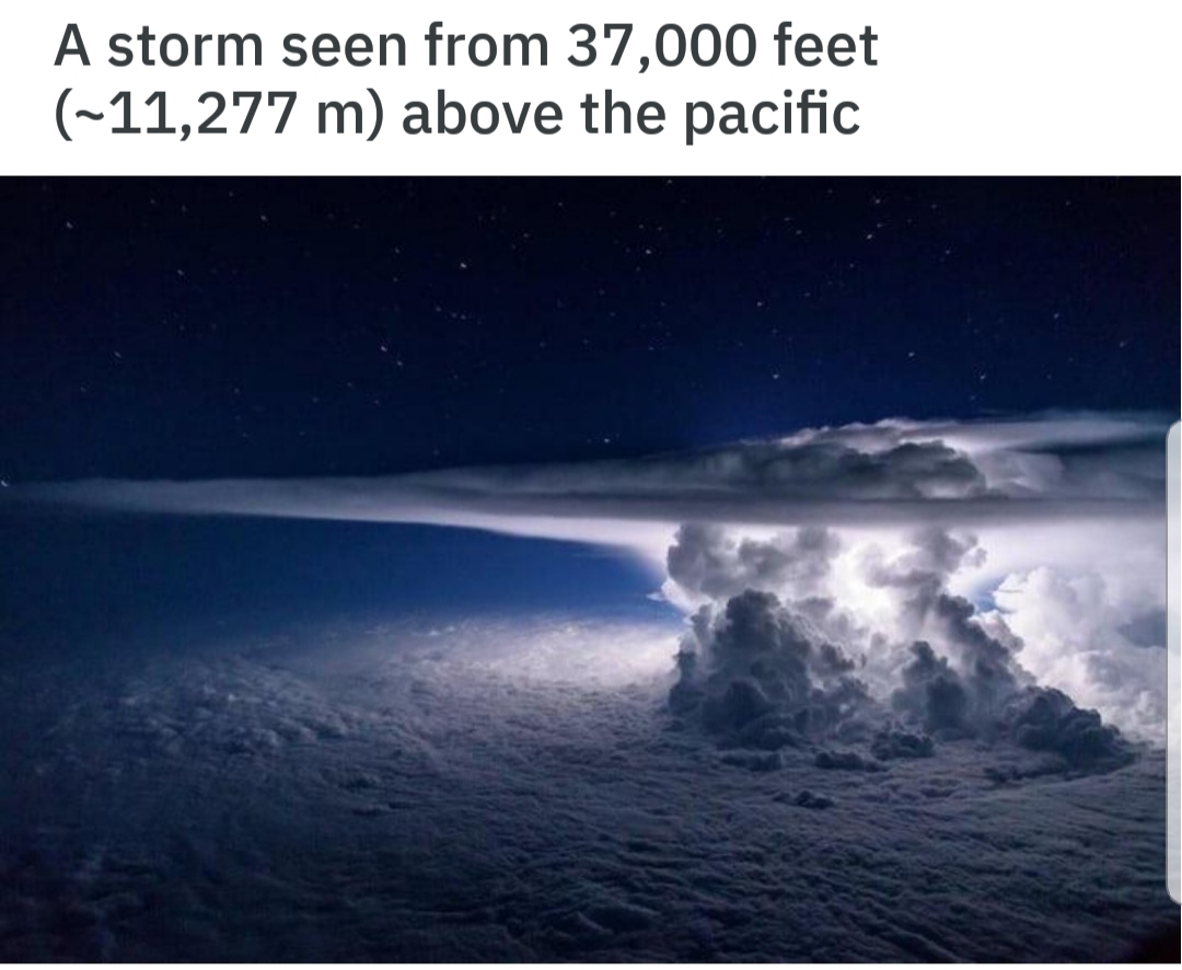 thunderstorm clouds from above - A storm seen from 37,000 feet ~11,277 m above the pacific