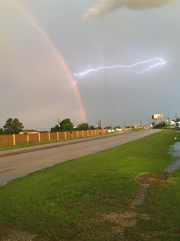 perfect timing lightning striking rainbow