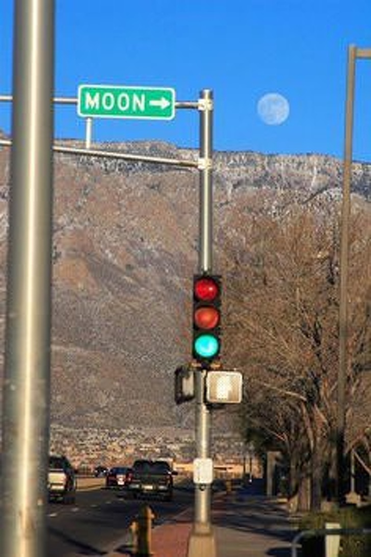 perfect timing sign pointing to moon - Moon>