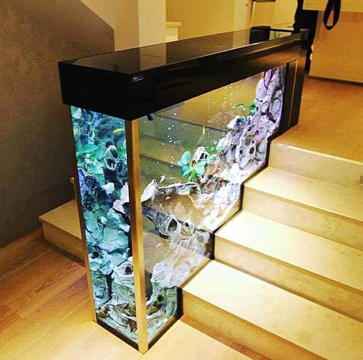 An aquarium decorating your staircase is an interesting surrealistic idea.