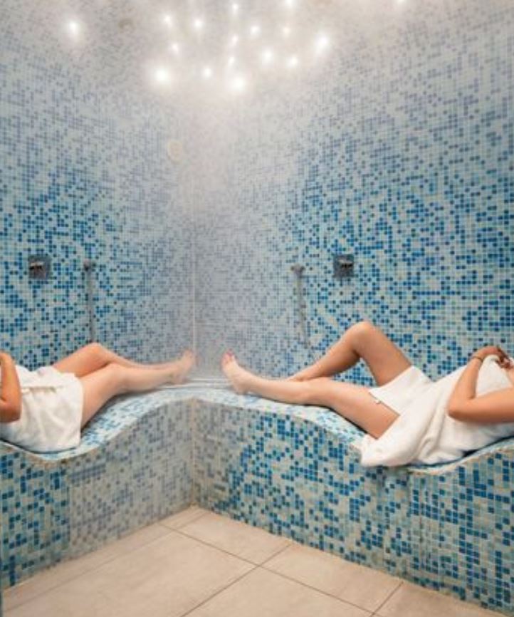 Lie down or take a shower in an insanely clever S-shaped steam room.