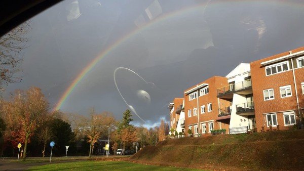 The steering wheel reflection looks like a planet in the sky