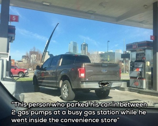 inside car on a gas station - "This person who parked his car in between 2 gas pumps at a busy gas station while he went inside the convenience store"