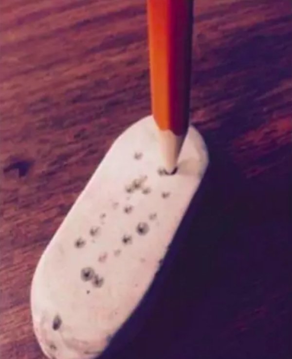 eraser stabbed by pencil
