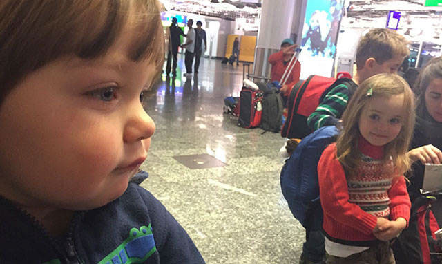 little girl looking at boy airport