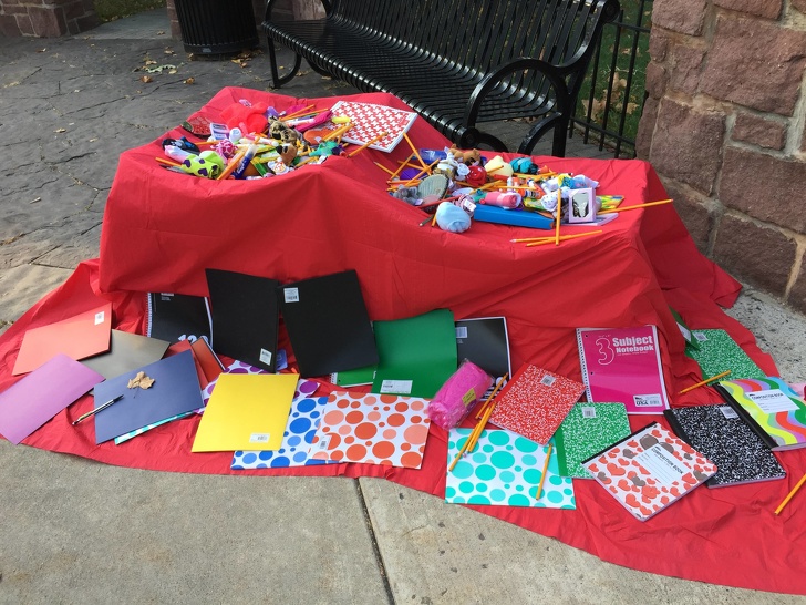 “On the first day of school, our local crossing guard set this up at her intersection for kids who needed something. She paid for it all herself.”