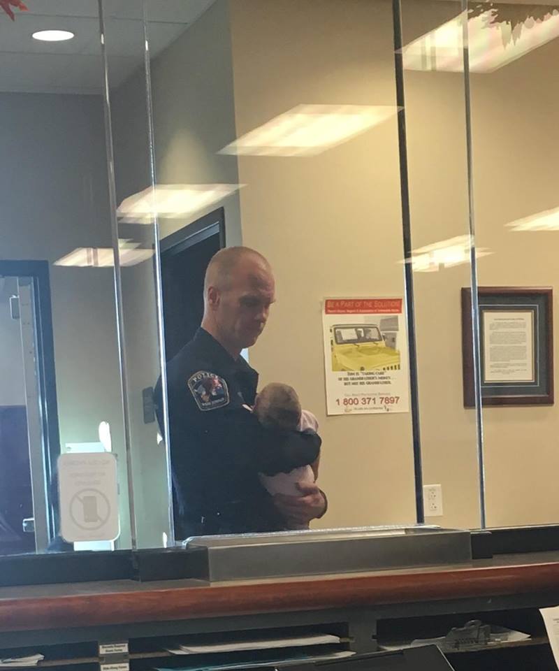 The baby’s mom was filing a police report so this police officer cared for him for hours.