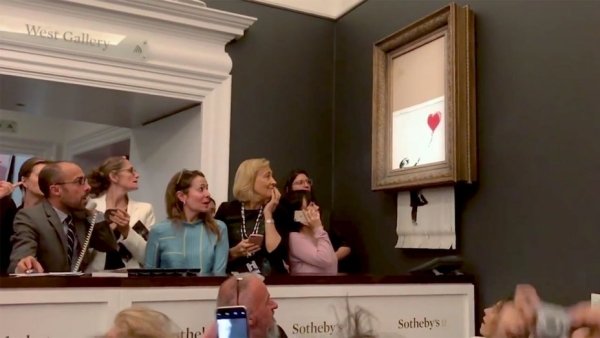 A Banksy painting immediately “self-destructed” itself after being sold at an auction for $1.4 million.