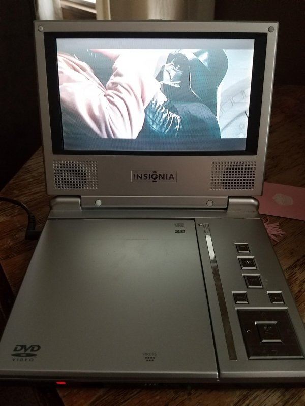 Watching movies on a portable DVD player. That thing came on every single vacation.