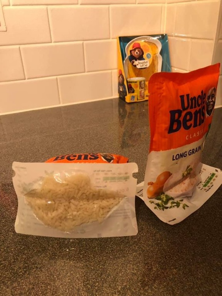 Microwaveable rice pouches have tabs at the bottom that you can open to stop them from falling over while cooking.
